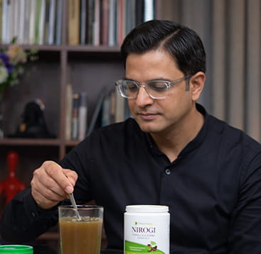 Mix in a glass of lukewarm or normal water, or take it directly with water